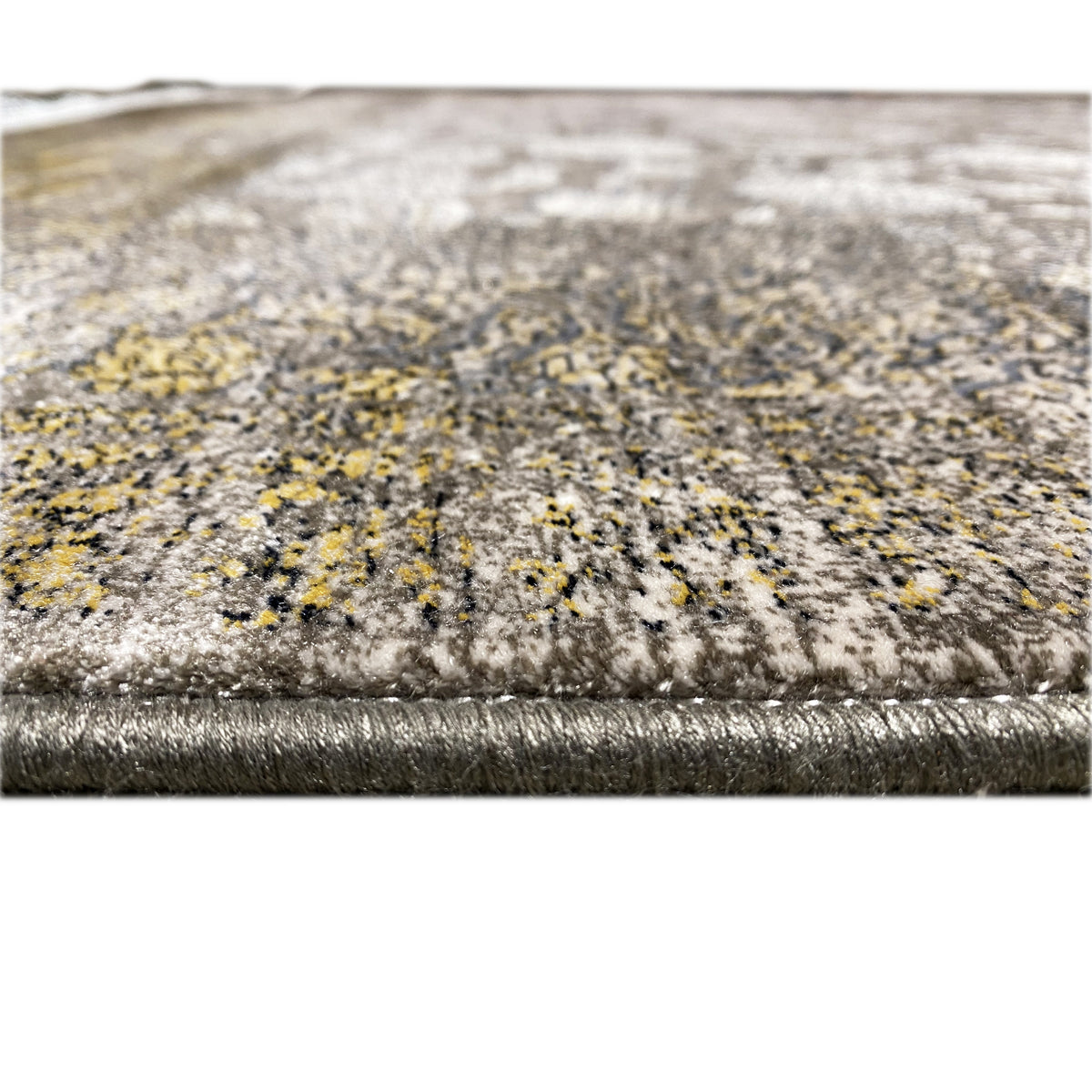 Teppich „Ewiger Herbst“ 170x240 cm, Detail der Kante mit Fransen und silbrigem Blumenmuster