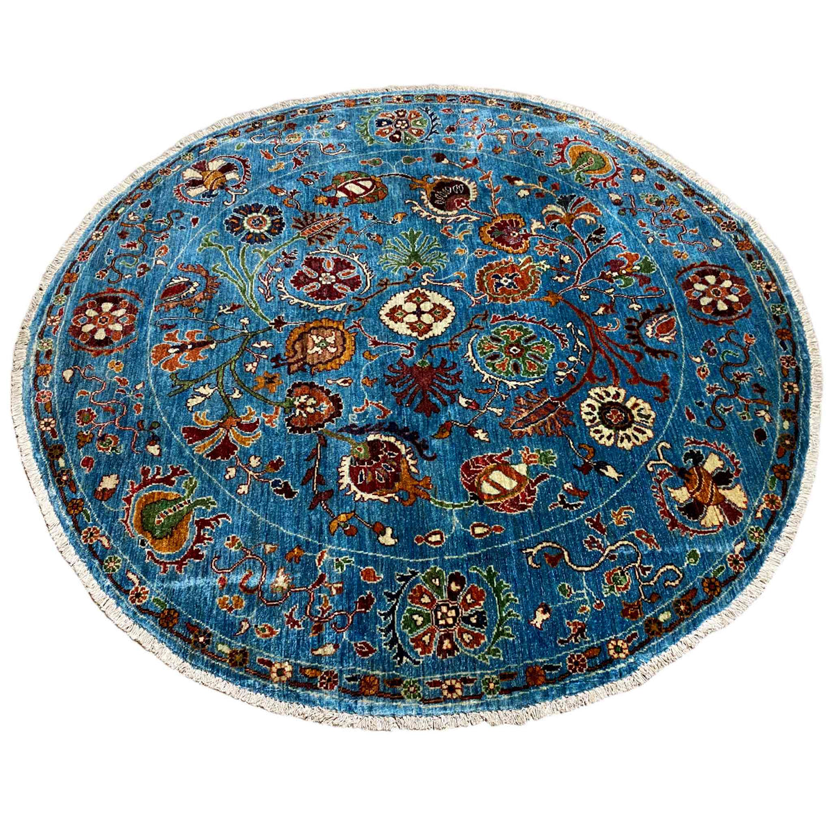 Runder Wollteppich in Blau mit lebendigem Blumenornament und detailreichem Rand