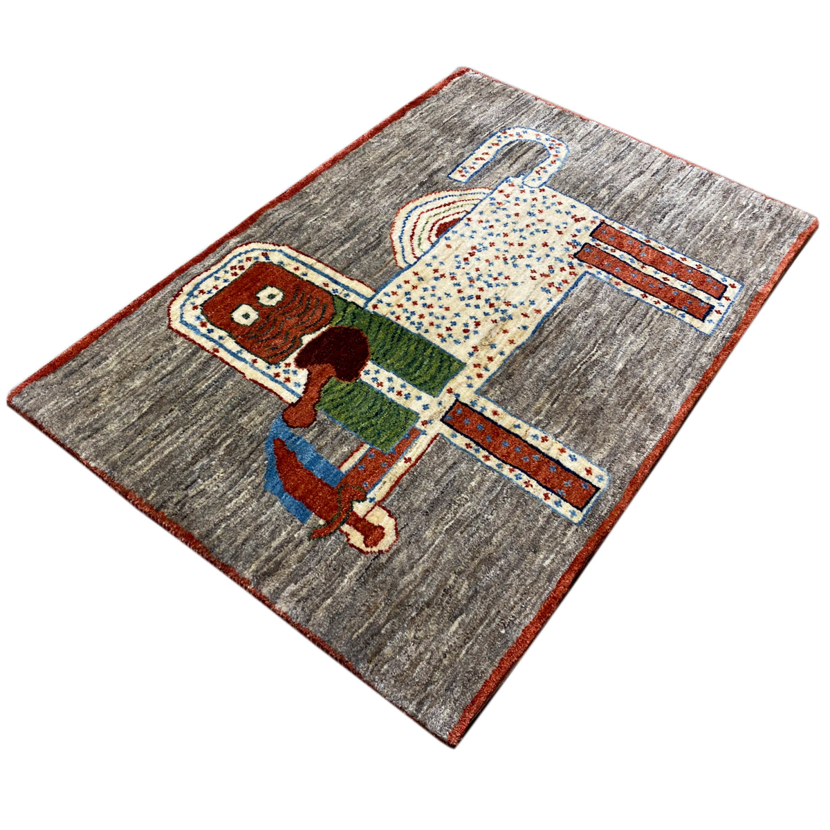 Löwen-Gabbeh-Teppich 117x79 cm, diagonaler Blick auf Tiermotiv mit farbigen Umrandungen