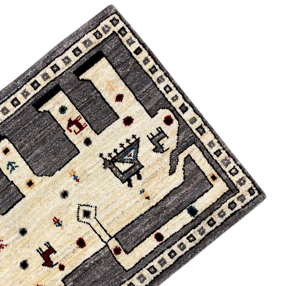 Gabbeh-Teppich-Ecke mit Zierbordüre, cremefarbenem Hintergrund und grauen Rechtecken