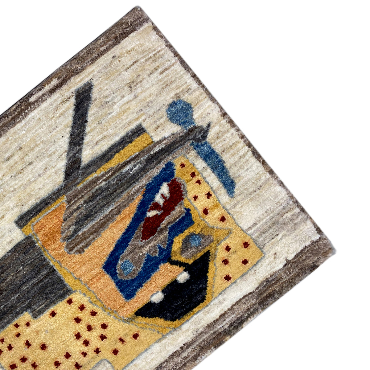 Nahansicht am Rand: beiges Muster mit gelbem Quadrat, blauer Figur und dunklen Linien