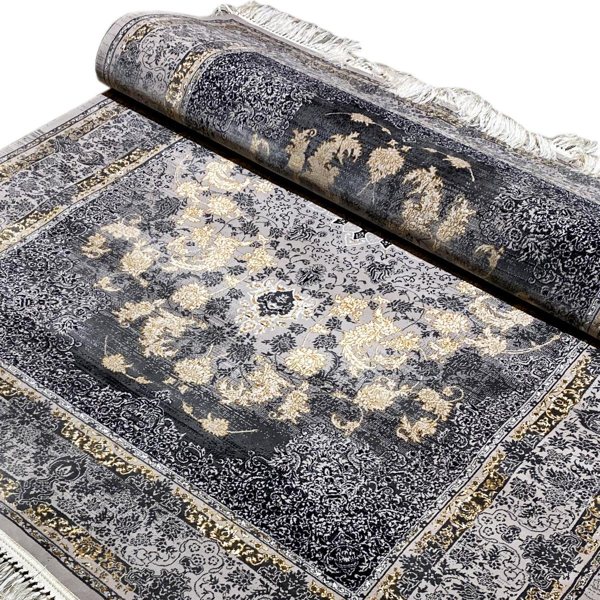 Teppich 160x230 gerollt, dunkelgraues Muster mit goldbeigen Blüten, Fransen am Rand
