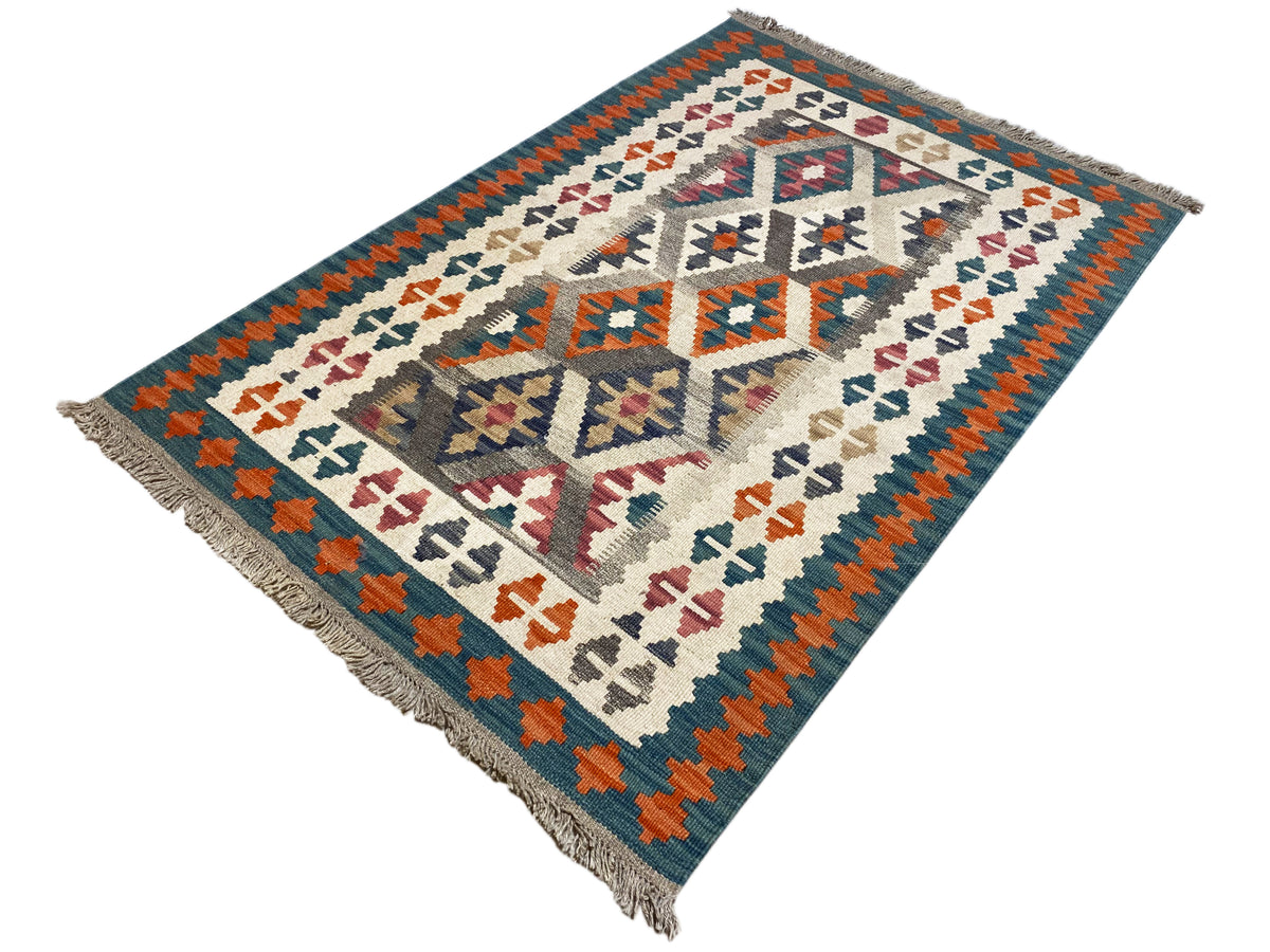 Kelim-Teppich mit zentriertem Rauten-Design und bunten Symbolen, Fransen an den Ecken