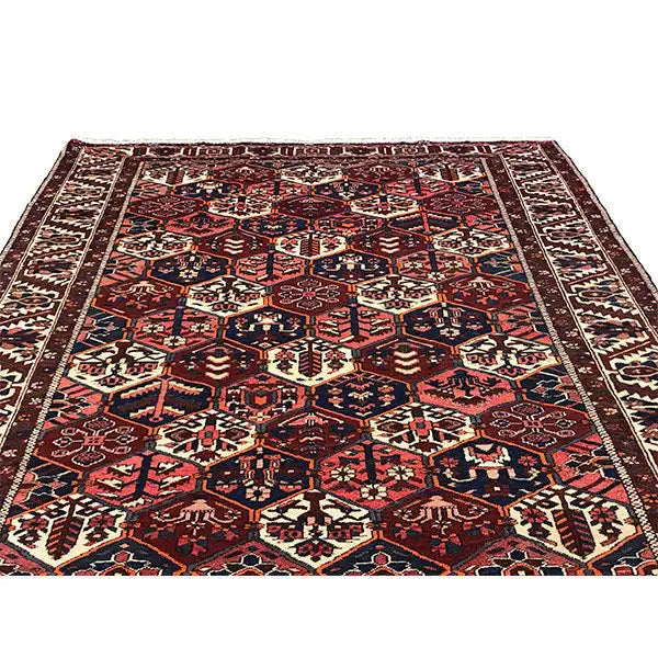 Perserteppich mit dichtem geometrischem Ornament, dunkelrot, blau, beige