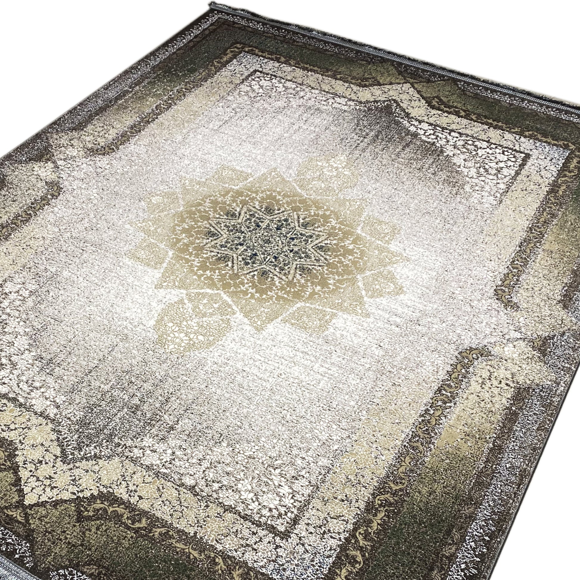 Grün-grauer Orientteppich mit Used-Look und Fransen.