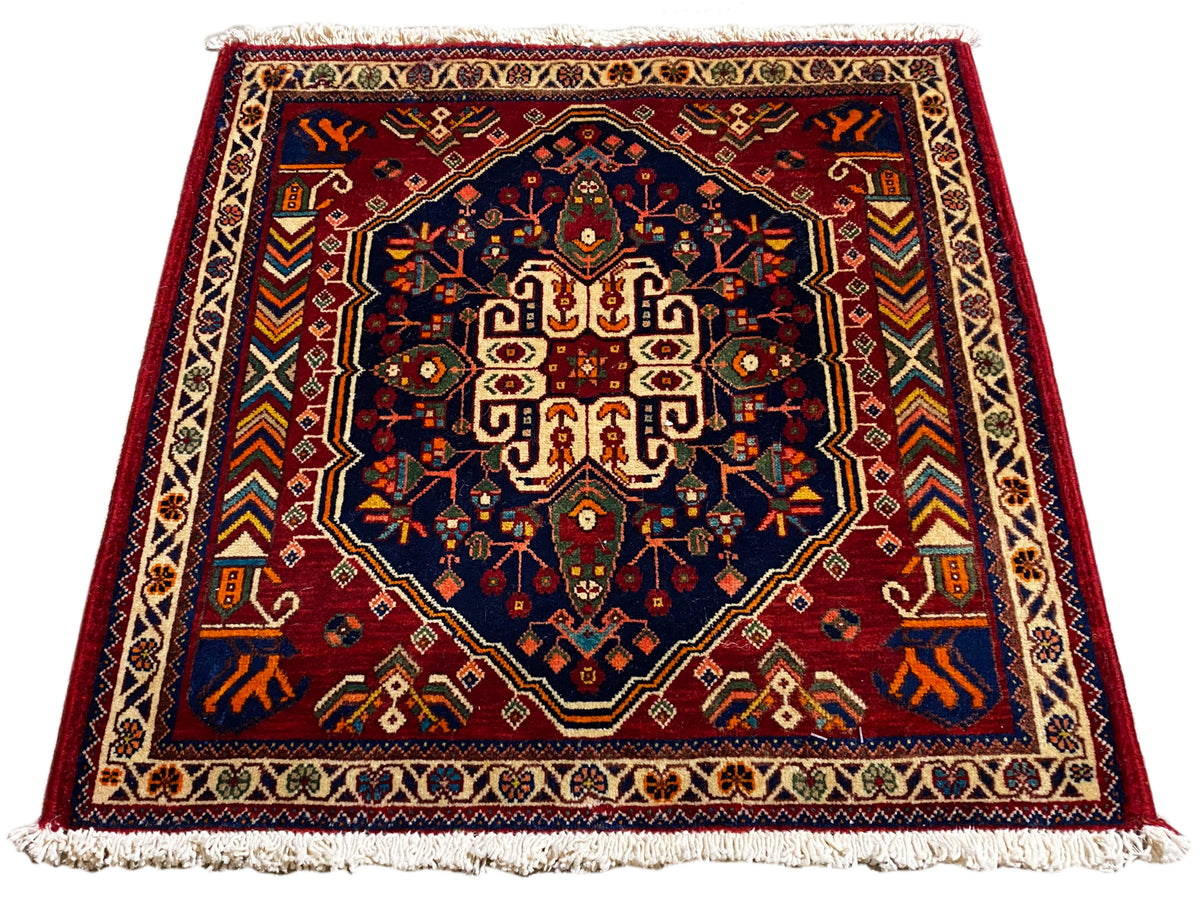 Teppich 63x60 cm, rechteckig, dunkelblaues Zentrum mit farbigem Ornamentrahmen