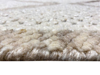 Neutraler Wollteppich im Berber Stil fürs Wohnzimmer